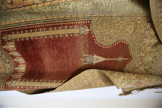 A Turkish Kum Kapri silk red ground hanging prayer rug, 6ft 6in by 4ft 6in.